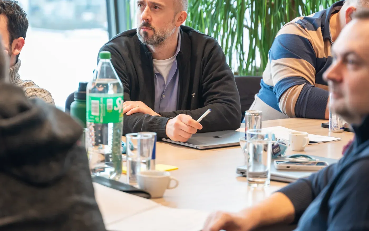 Engineering managers practising a new technique on site during a workshop