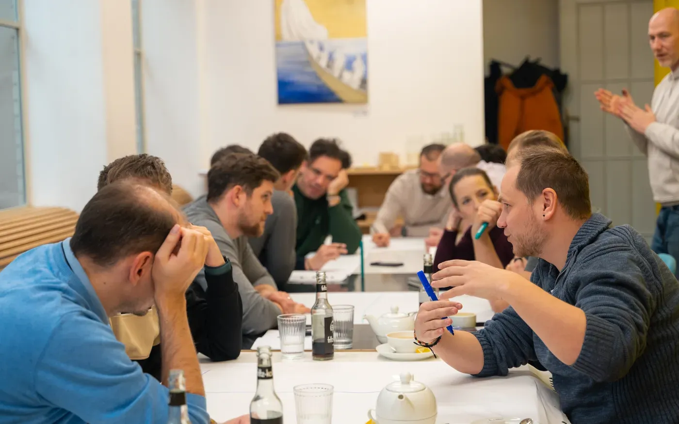 An Academy lecturer working through a case with engineering managers