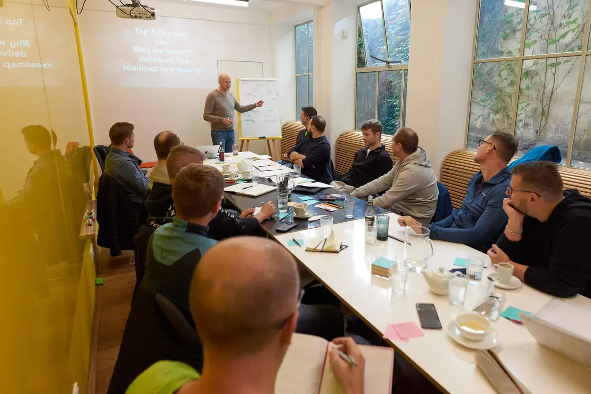 A cohort of engineering leaders working through an Academy session