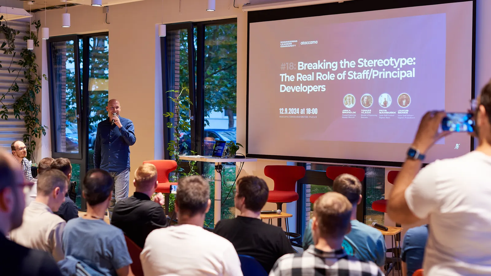 ELC meetup speaker presenting to a room of engineering leaders in Prague